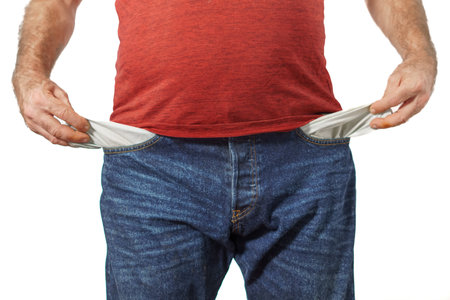 man with jeans showing his empty pocketsの写真素材