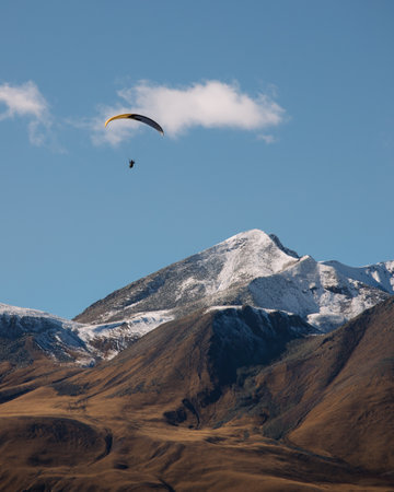 Paragliding above caucasian mountains in Georgiaの写真素材