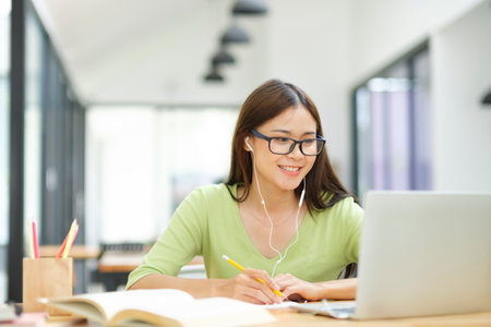 Young woman video conference and study online at home.の写真素材