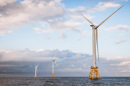 Wind turbines sitting off shore in the Atlantic Oceanの写真素材