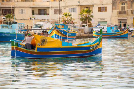 Eyed colorful boats Luzzu in the Harbor village Marsaxlokk, Maltaのeditorial素材