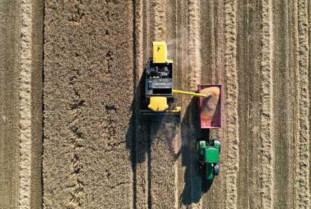 Aerial drone view of a tractor tilling the landのeditorial素材