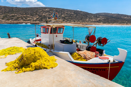 Colorful boat in blue water on Amorgos, Greek Islandsのeditorial素材