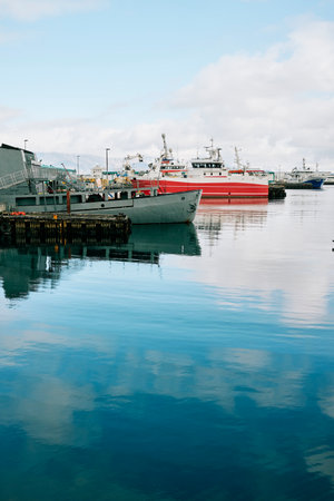 Modern boats moored in tranquil sea waterのeditorial素材