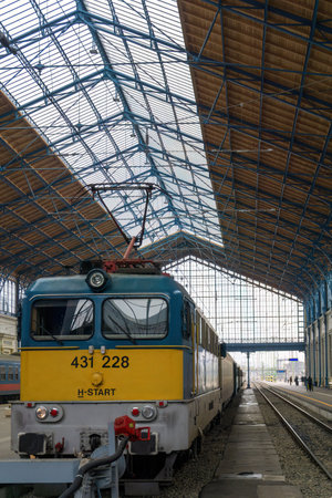 Blue and yellow train at the Central Station in Budapestのeditorial素材