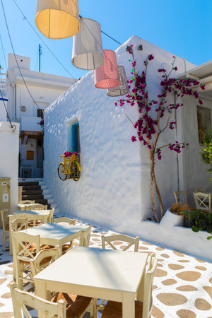 Colorful lanterns hang between stucco building on Naxos, Greeceのeditorial素材