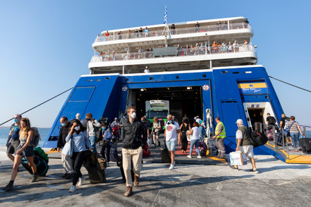 Travelers disembark from a ferry on Santorini in the Greek Islesのeditorial素材