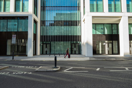 Man with wheeled suitcase walking in Victoria streetのeditorial素材