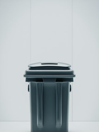 Sleek gray trash bin against a minimalist backdrop, emphasizing cleanliness and modern design.の素材