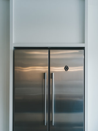 A modern stainless steel refrigerator with minimalist design, enhancing the sleek kitchen aesthetic.の素材