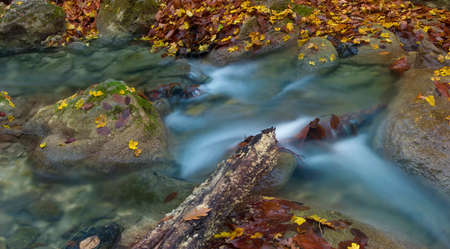 Little waterfall in Crimea mountains in autumn