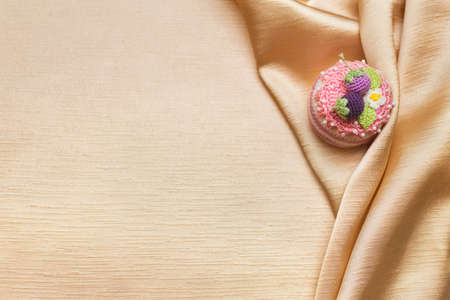 One crocheted cake on the silk
