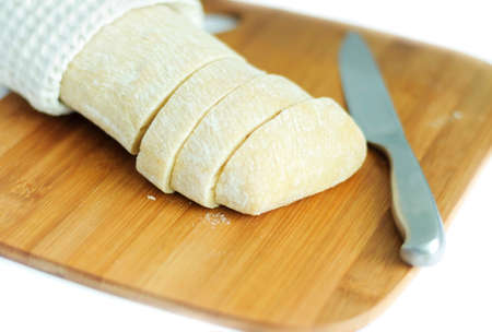 White bread and knife on the cutting boardの写真素材