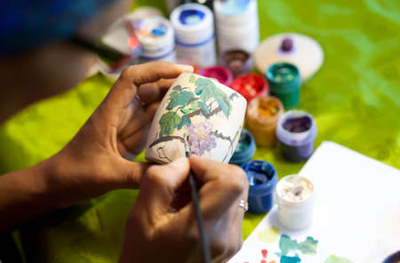 The artist paints with bright colorsの写真素材