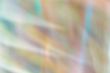Blurred abstract background. Random soft pastel shafts of rainbow coloured lightの写真素材