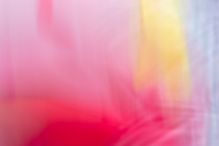 Blurred abstract background. Hot pink with wispy yellows and whites.の写真素材