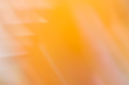 Blurred abstract background. Pointed angles of light with orange background.の写真素材
