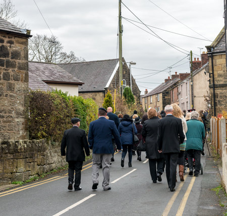 WREXHAM, UK - NOVEMBER 13, 2016: The Remembrance Parade along Park Road, Coedpoeth. An annual parade from St Tydfil church to the War memorial on Remembrance Sunday, also known as Poppy Day.のeditorial素材