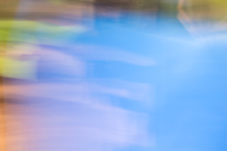 Blurred abstract background. Colourful pastel water reflections concept.の写真素材