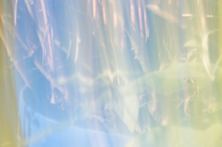 Blurred abstract background. Sparkling reflections concept. Blues and soft pastel colours.の写真素材
