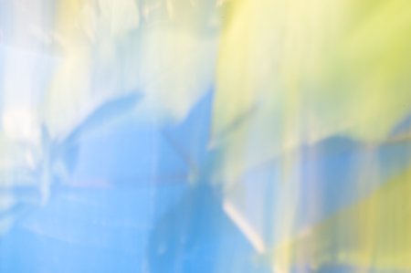 Blurred abstract background. Dancing pastel rainbow light. Blues and soft pastel colours.の写真素材