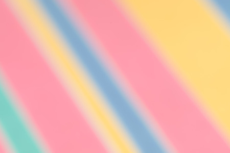 Blurred abstract background of pastel candy coloured diagonal stripes, for Easter, Mothers Day, baby showers and other spring and summer holidays and events.の写真素材