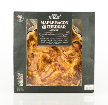 WREXHAM, UK - MAY 24, 2017: Tesco finest maple bacon and cheddar quiche. Made with 100% British pork. On a white background.のeditorial素材