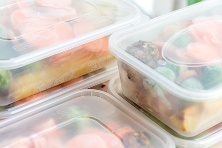 Meal prep. Close up of home cooked roast chicken dinners in containers ready to be frozen for later...
