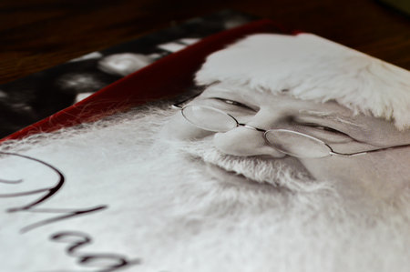 WREXHAM, UK - DECEMBER 16, 2013: Closeup of Christmas cards laying on a table mostly showing the face of father Christmas. Taken down ready to dispose of at the end of the season.のeditorial素材