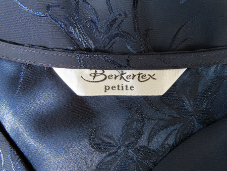 Wrexham, UK - June 07, 2018: Berkertex petite womens clothing label on navy blue top. Close up of label.のeditorial素材