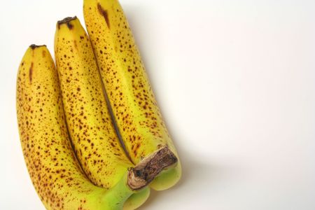 three rotten bananas (the top of the stem, where the 3 come together is in focus)の写真素材