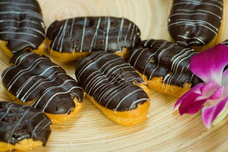 filled pastry with cholocate cover and flower