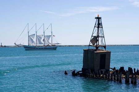 a sail boat navigating near the chicago coast on lake michigan
