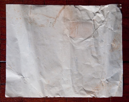 The Old paper isolated on wood backgroundの写真素材