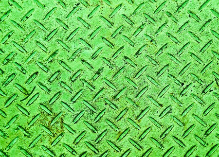 The Green grunge steel floor plate background texture