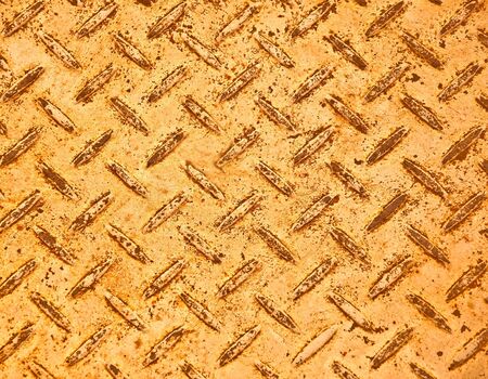The Yellow grunge steel floor plate background texture