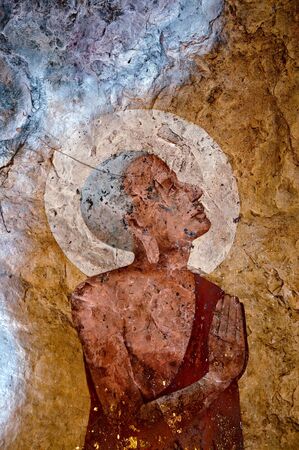 The Old painting of buddha status in caveのeditorial素材