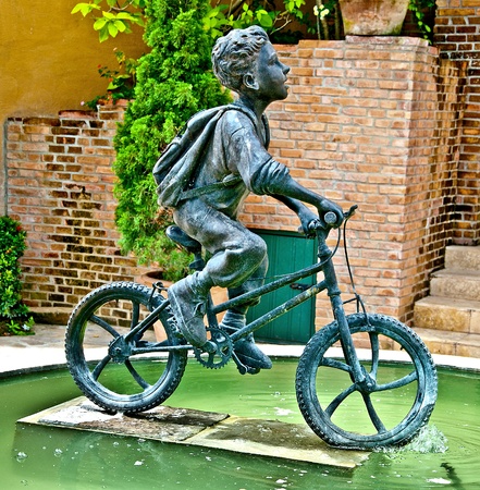 The Sculpture steel of boy ride bicycle monumentの写真素材