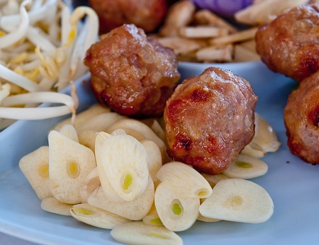 The Closeup nam nuong of vietnamese food  have grilled pork ball served with dipping sauce and paper riceの写真素材