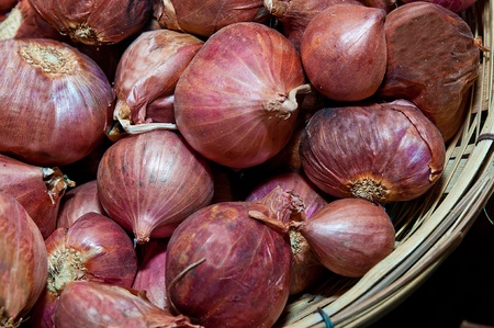 The Red shallot on bamboo basketの写真素材