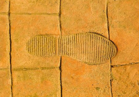 The Imprint of footprint on floor backgroundの写真素材