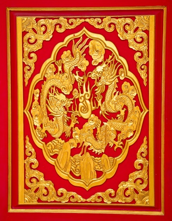 The Golden dragon on red wallの写真素材