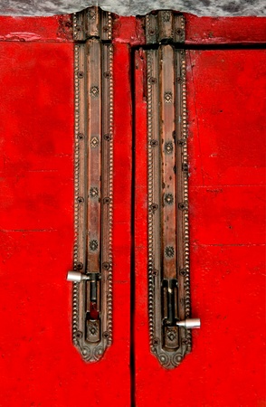The Iron lock with red wooden doorの写真素材