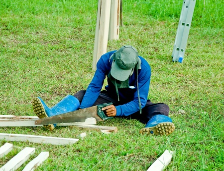 The Worker men cutting woodの写真素材