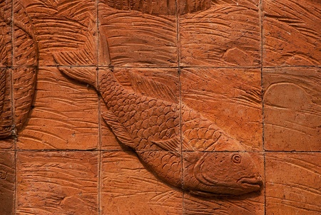 The Red tile earthenware of  pattern fish thai styleの写真素材