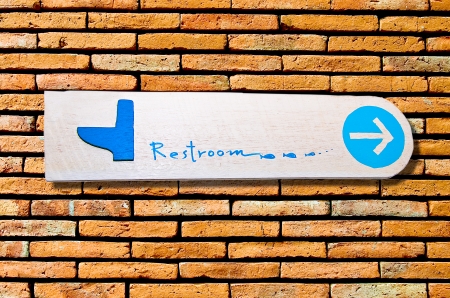 The Sign of restroom on wall backgroundの写真素材
