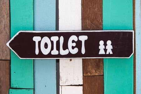 Sign restroom of  men and women on wood backgroundの写真素材