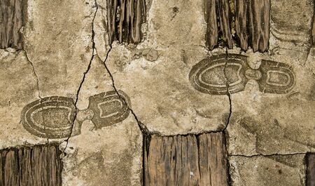 Old Imprint of footprint on cement floor backgroundの写真素材