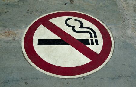 Sign of no smoking on floor backgroundの写真素材