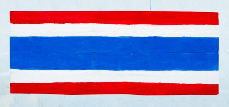 Painting flag of thailand on wallの写真素材